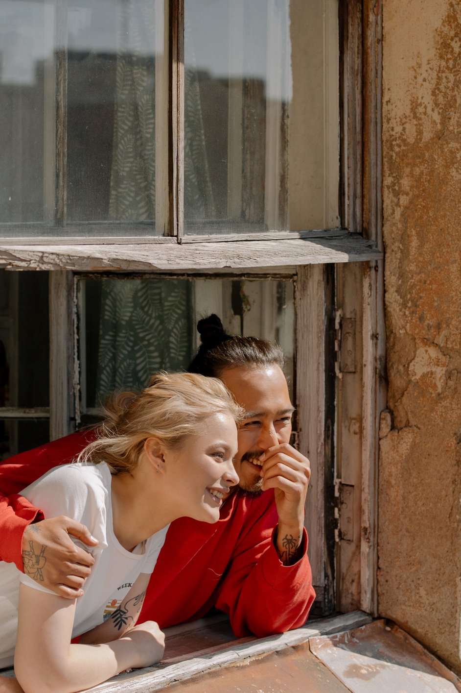 Woman in White Shirt Kissing Man in Red Shirt